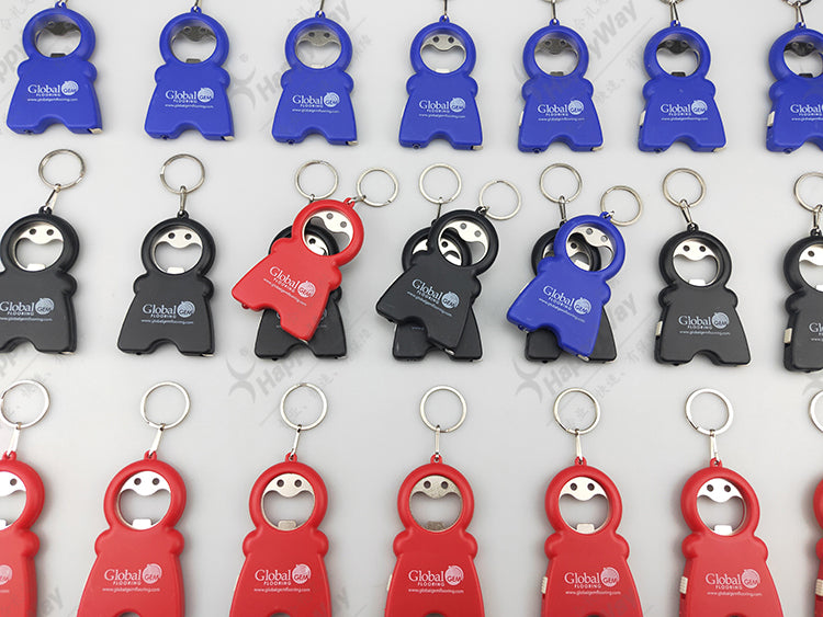 SMILING MAN KEYCHAIN WITH TAPE MEASURE, LED LIGHT AND BOTTLE OPENER